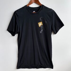 Nike Men's Black Tee with Gold Accent